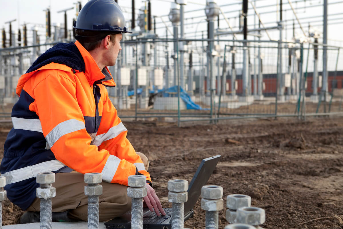 Man looking at electrical grid