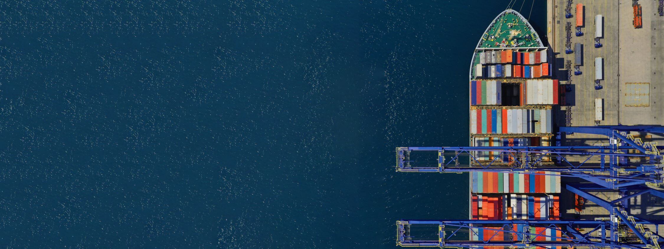 An overhead view of a cargo ship at a port