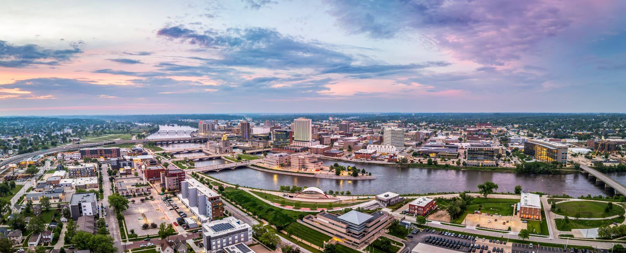 Panoramic aerial view of Cedar Rapids, Iowa under a pink and blue sky Panoramic aerial view of Cedar Rapids, Iowa under a pink and blue sky